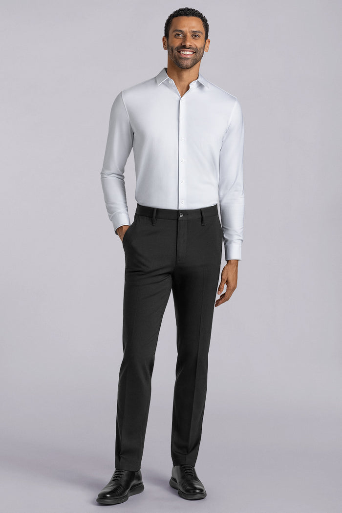 Model wearing Vigor Black Icy Knit mid rise pants, styled with white long sleeve shirt.