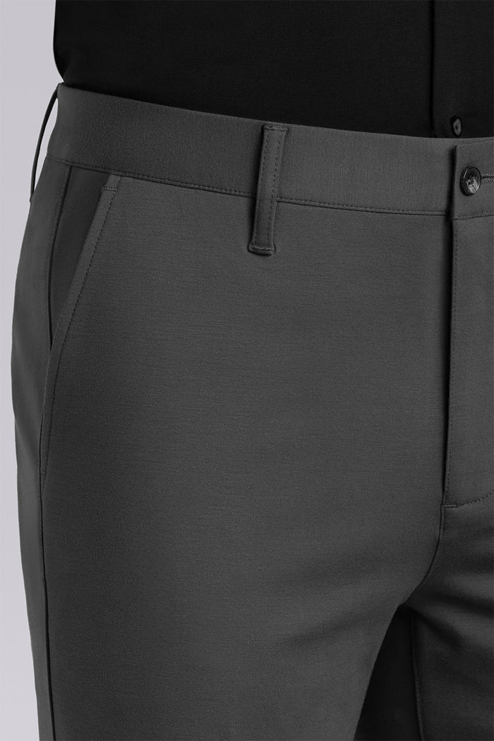Model wearing Vigor Dark Charcoal Icy Knit mid rise pants, styled with black long sleeve shirt.