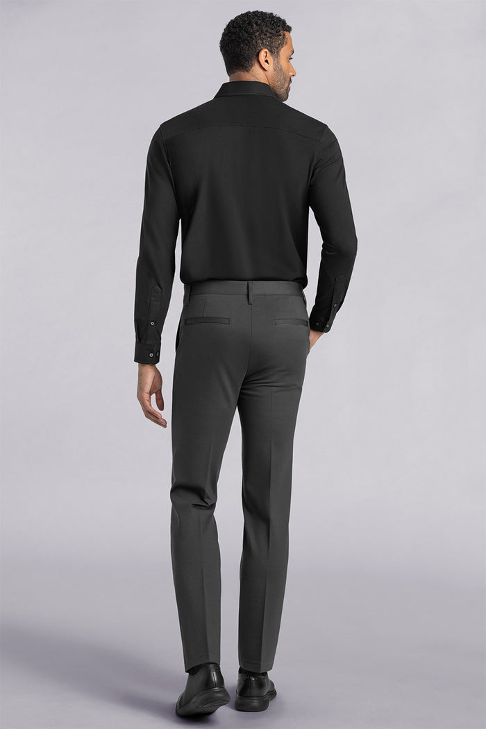 Model wearing Vigor Dark Charcoal Icy Knit mid rise pants, styled with black long sleeve shirt.