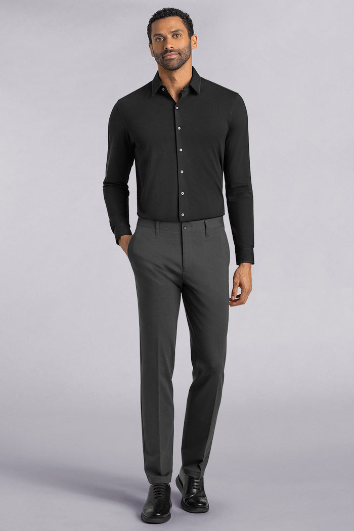 Model wearing Vigor Dark Charcoal Icy Knit mid rise pants, styled with black long sleeve shirt.
