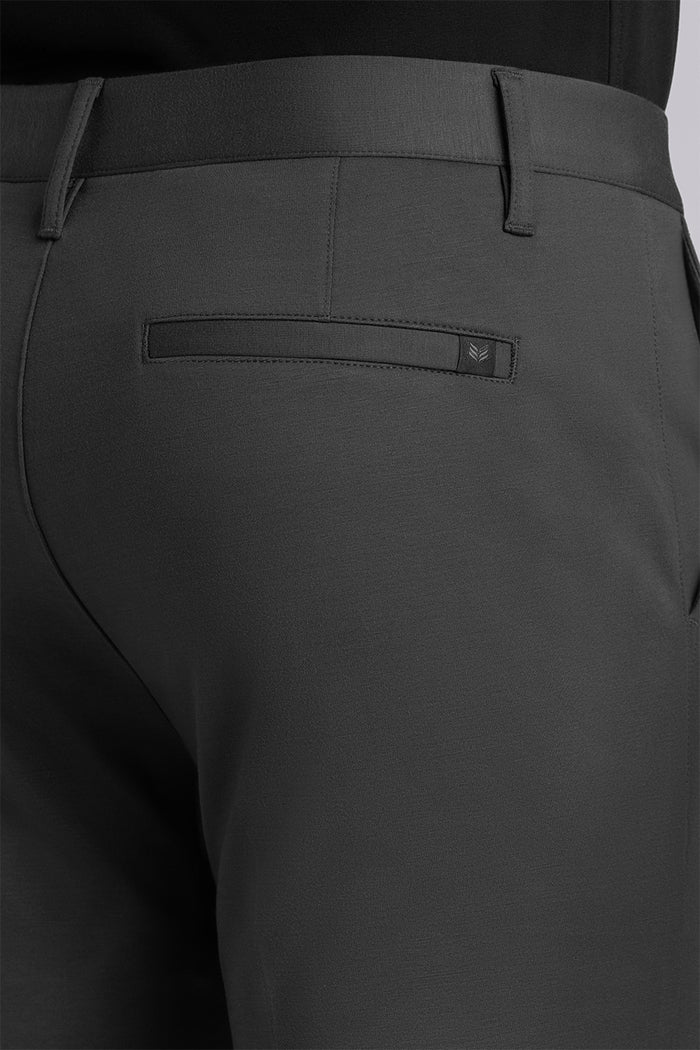 Model wearing Vigor Dark Charcoal Icy Knit mid rise pants, styled with black long sleeve shirt.
