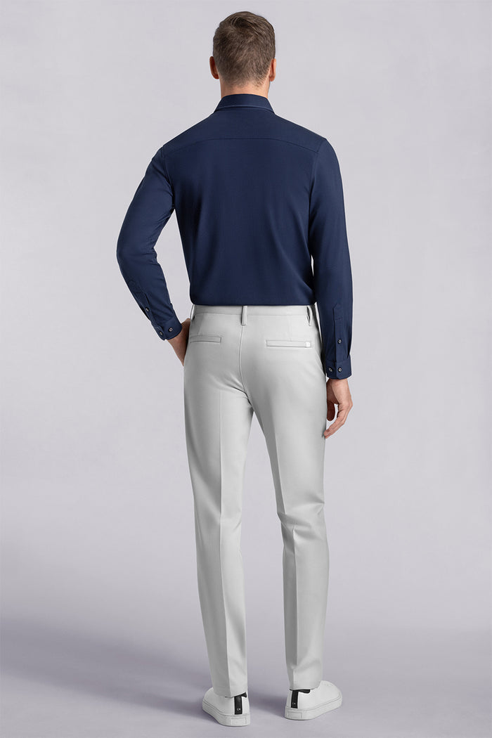 Model wearing Vigor Light Grey Icy Knit mid rise pants, styled with navy long sleeve shirt.