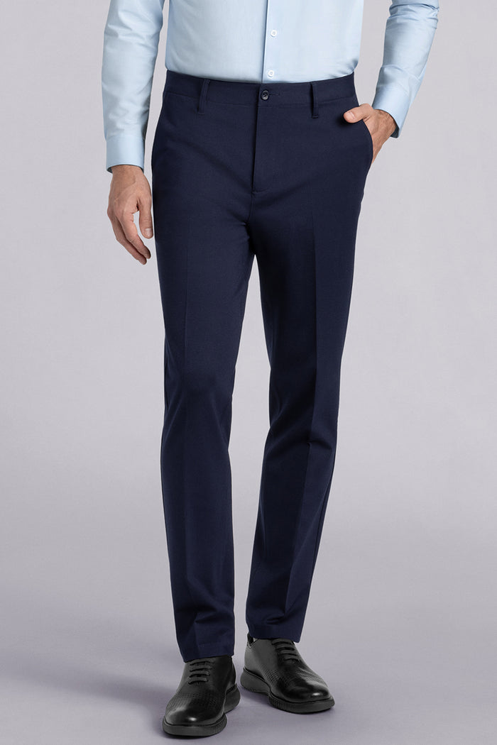 Model wearing Vigor Navy Icy Knit mid rise pants, styled with light blue long sleeve shirt.