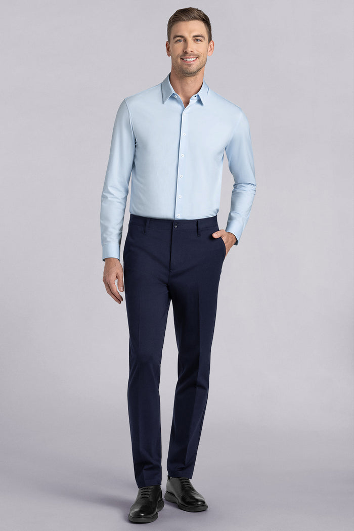 Model wearing Vigor Navy Icy Knit mid rise pants, styled with light blue long sleeve shirt.