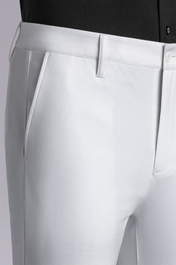 Model wearing Vigor White Icy Knit mid rise pants, styled with black long sleeve shirt.