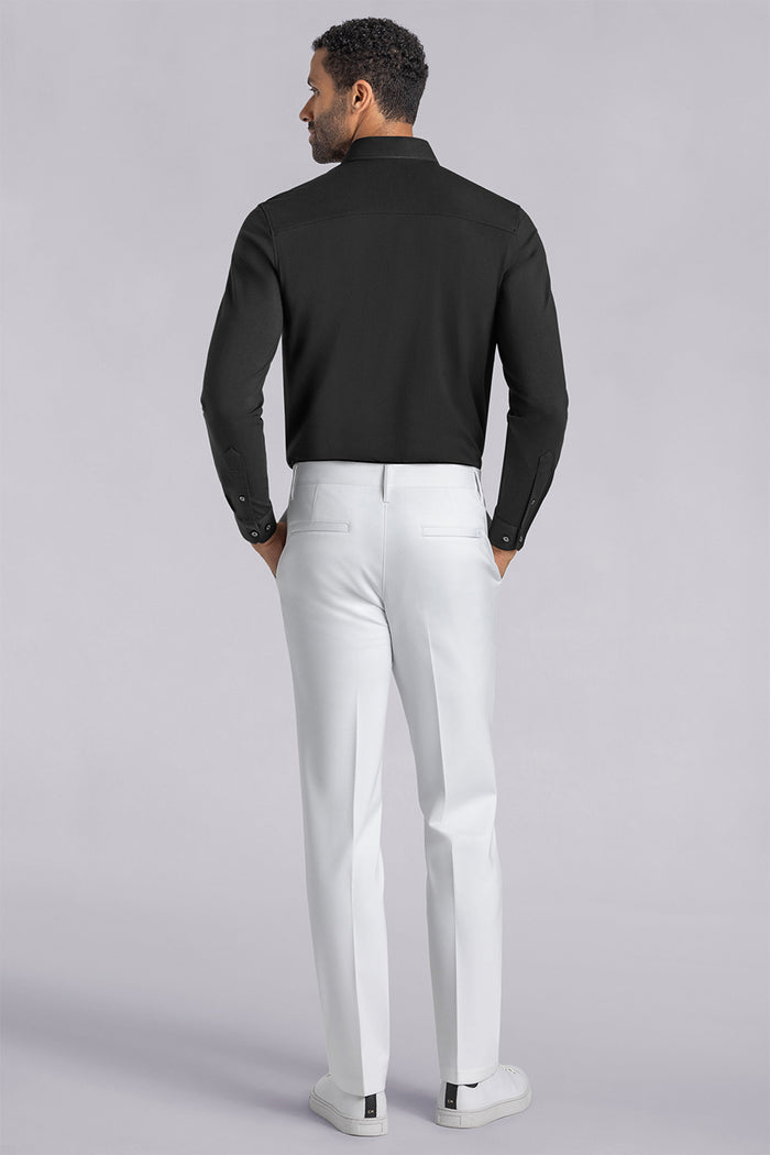 Model wearing Vigor White Icy Knit mid rise pants, styled with black long sleeve shirt.