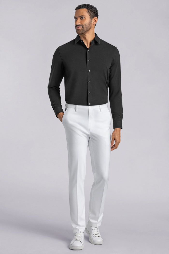 Model wearing Vigor White Icy Knit mid rise pants, styled with black long sleeve shirt.
