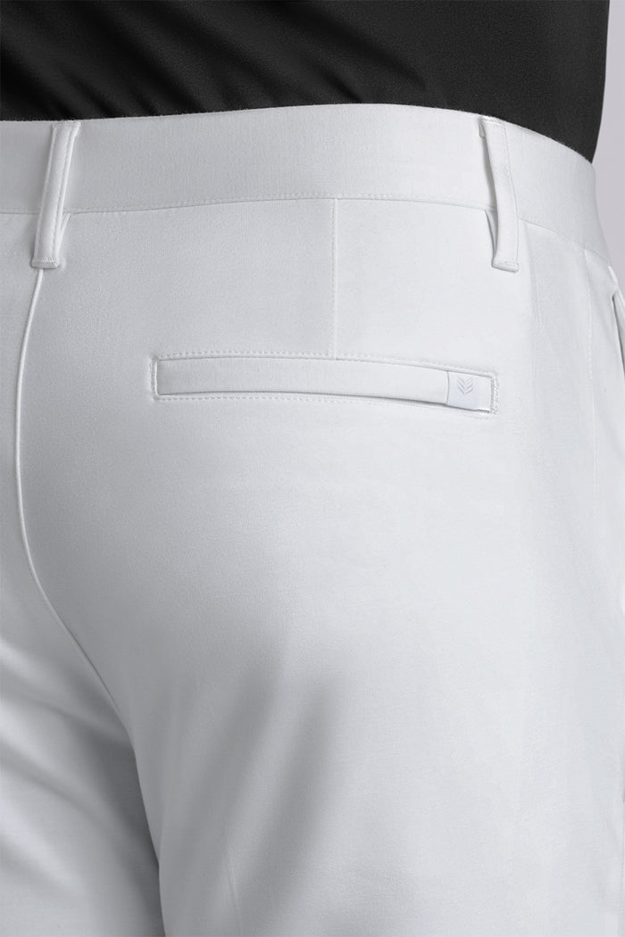Model wearing Vigor White Icy Knit mid rise pants, styled with black long sleeve shirt.