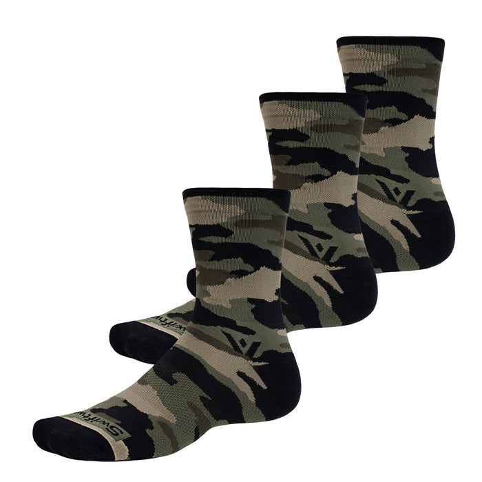 Three Swiftwick Vision Mid-Crew Camo Socks on a white background