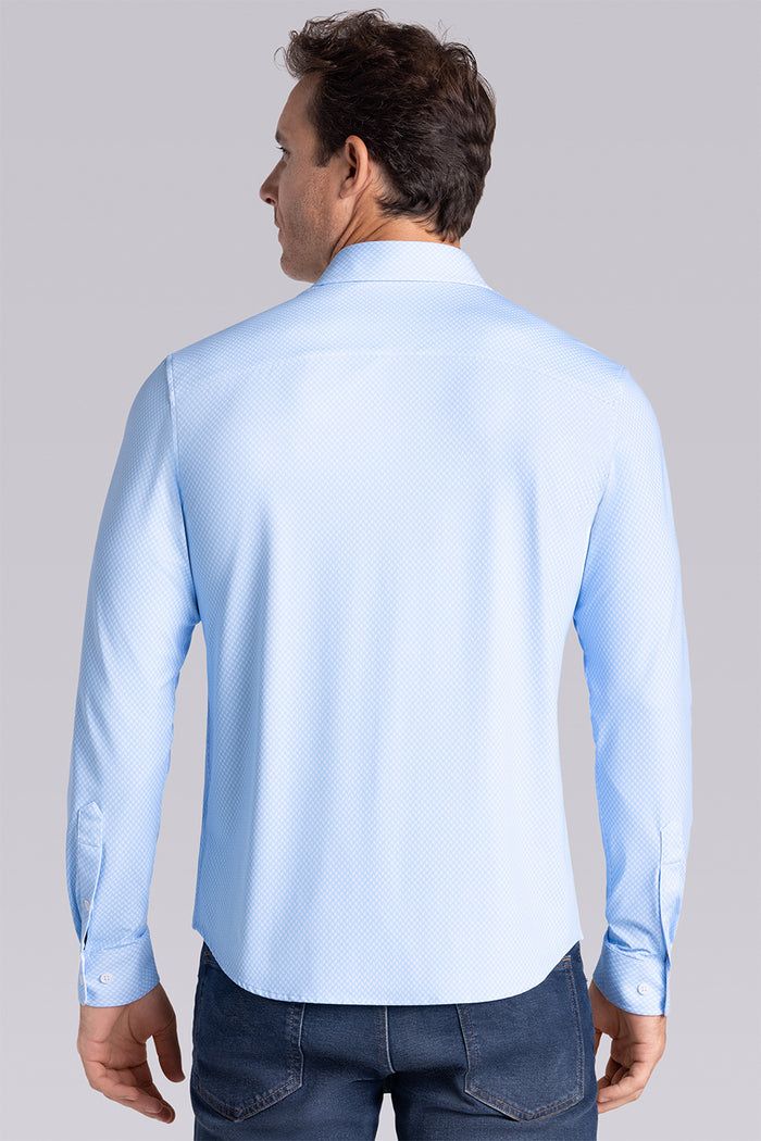 Model wearing Wavelength Light Blue 6-WayKnit® long sleeve shirt classic collar, styled with navy pants.