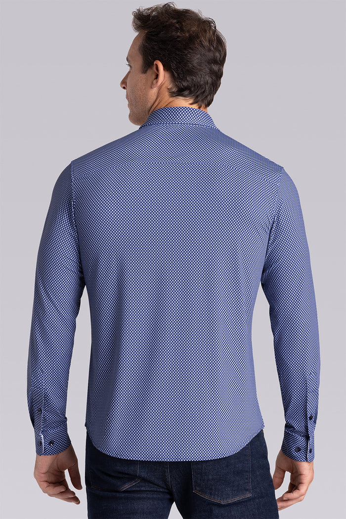 Model wearing Wavelength Navy 6-WayKnit® long sleeve shirt classic collar, styled with black pants.