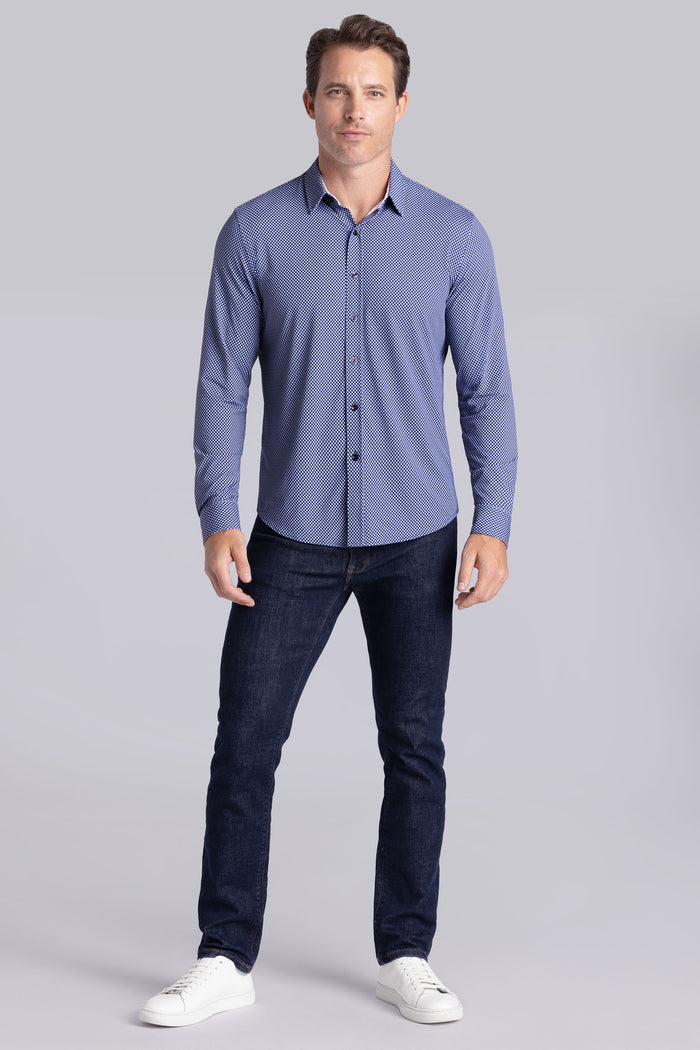 Model wearing Wavelength Navy 6-WayKnit® long sleeve shirt classic collar, styled with black pants.