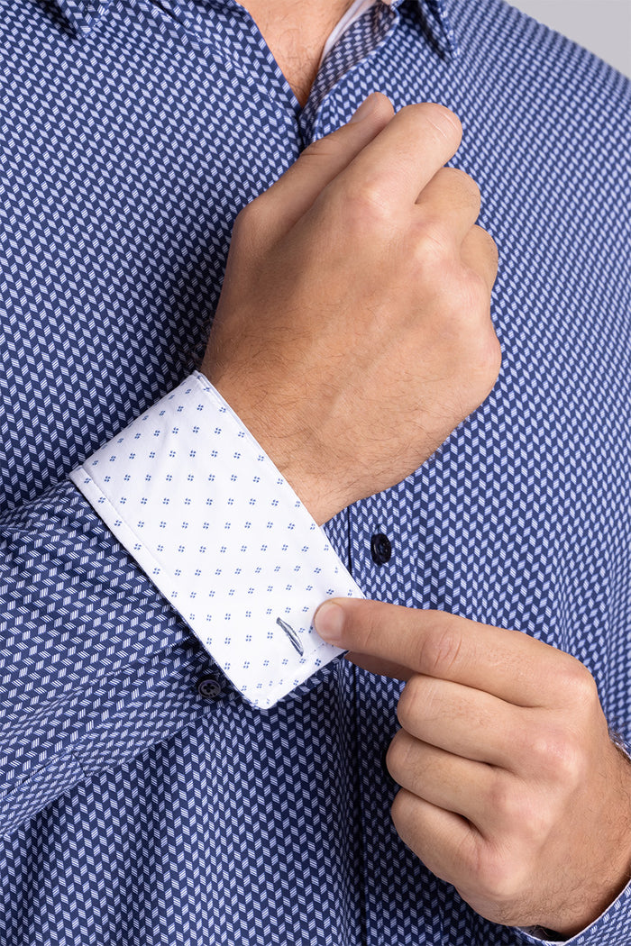 Model wearing Wavelength Navy 6-WayKnit® long sleeve shirt classic collar, styled with black pants.