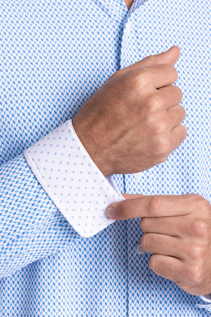 Model wearing Wavelength Ocean Blue 6-WayKnit® long sleeve shirt classic collar, styled with black pants.