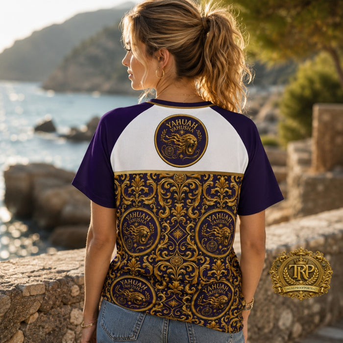 Back view of woman by the sea wearing Yahuah Yahusha unisex raglan mesh shirt with intricate gold baroque lion emblems.