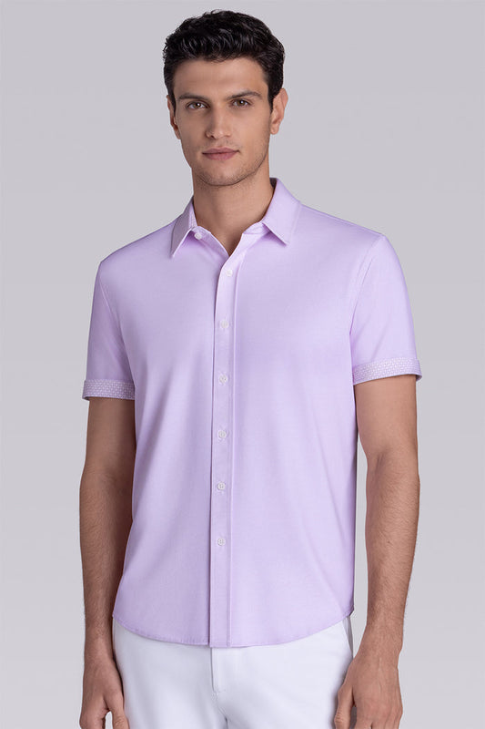 Model wearing Zest Lilac short sleeve classic collar shirt, styled with white shorts.