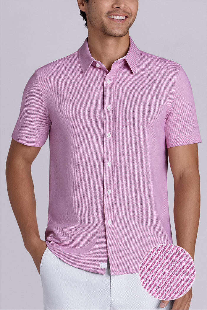 Model wearing Zest Raspberry short sleeve classic collar shirt, styled with white shorts.